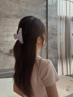 Lifestyle shot – model styling with Big Dipper Hair Claw in Purple, casual chic look