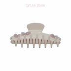 Side view of Gabrielle Claw in Jade Butter – curved teeth design for secure grip