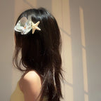 Model wearing Blue Orchid Barrette – chic floral hair accessory for elegant styling
