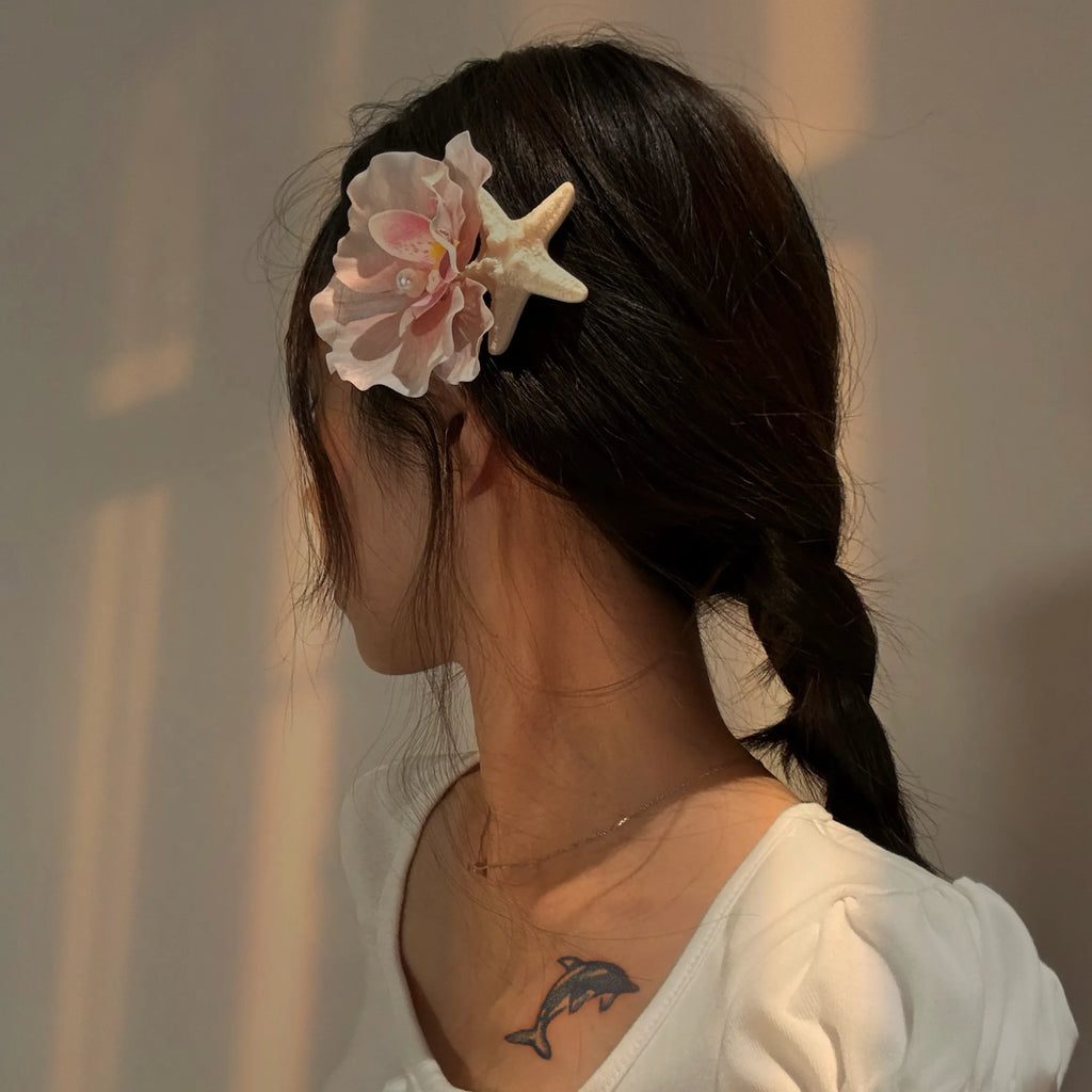 Model wearing Orchid Barrette – chic floral barrette hair accessory